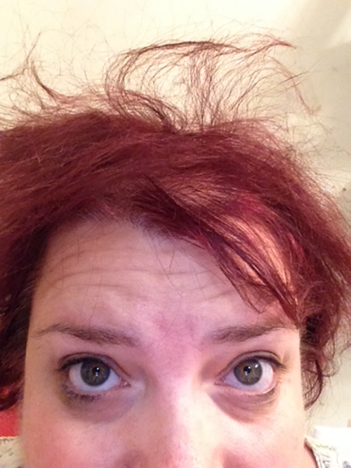 Michelle looking up toward her bedhead