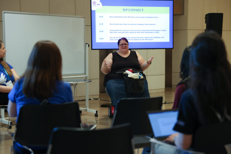 Michelle speaking to a group at WordCamp Europe