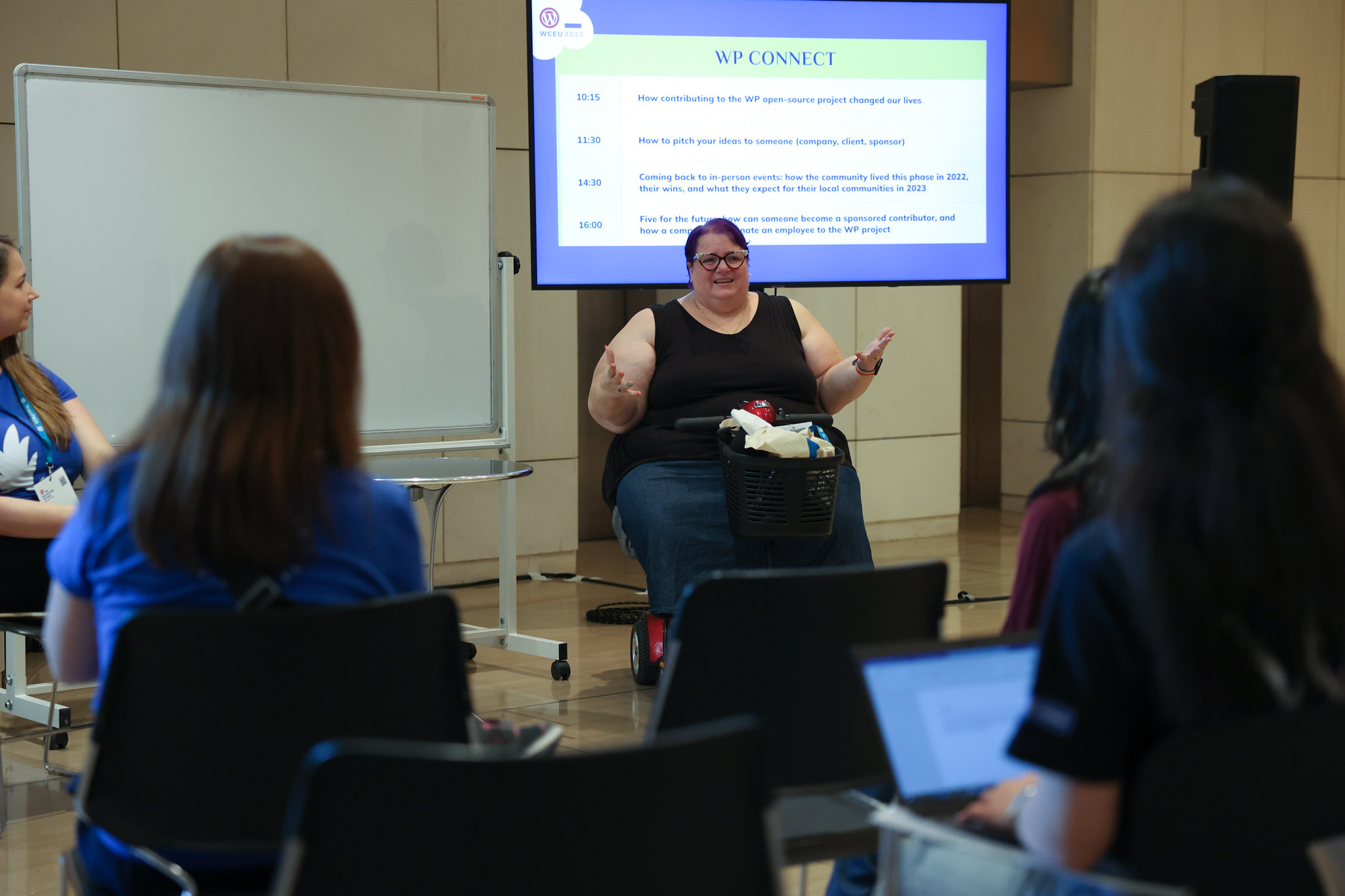 Michelle speaking to a group at WordCamp Europe