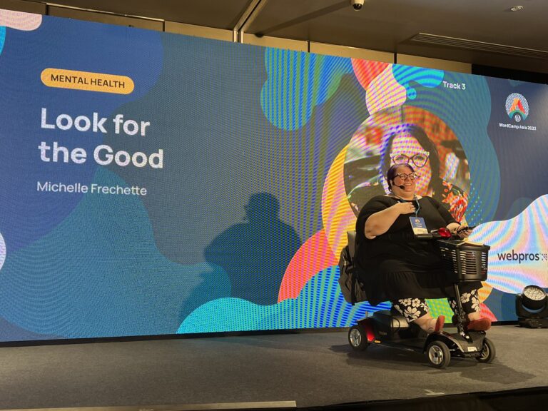 Michelle speaking on the stage at WordCamp Asia 2023