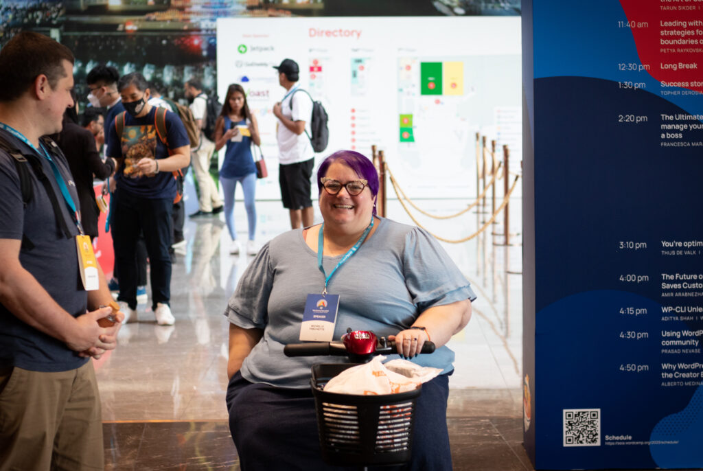 Michelle on her scooter at WordCamp Asia 2023