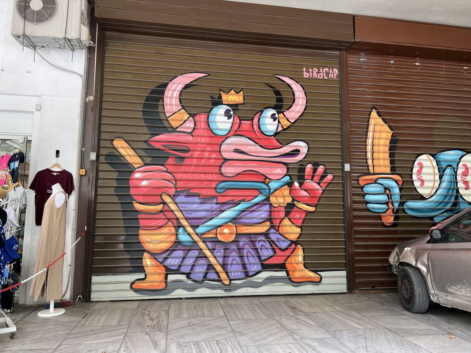 Graffiti of a strange creature on a garage door.