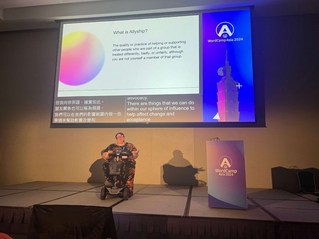 Michelle Frechette on stage at WordCamp Asia 2024 - Allyship presentation